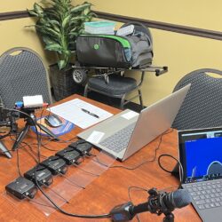 Deposition recording gear in use on conference table