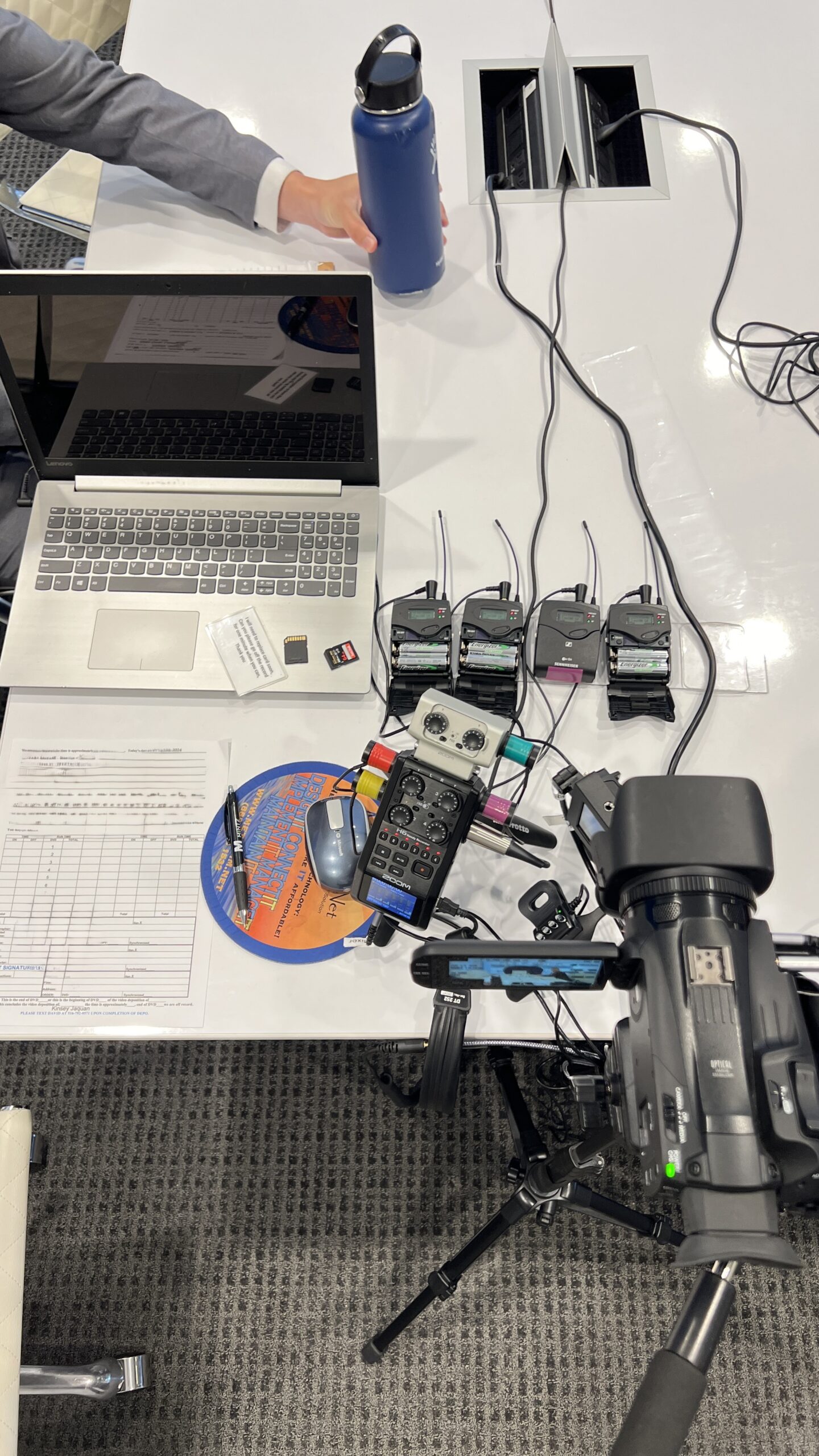 deposition recording gear in use on conference table