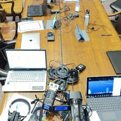 Deposition recording gear in use on conference room table