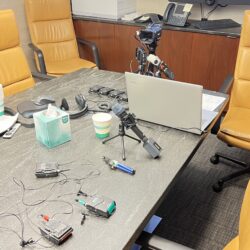 Deposition recording gear in use on conference room table