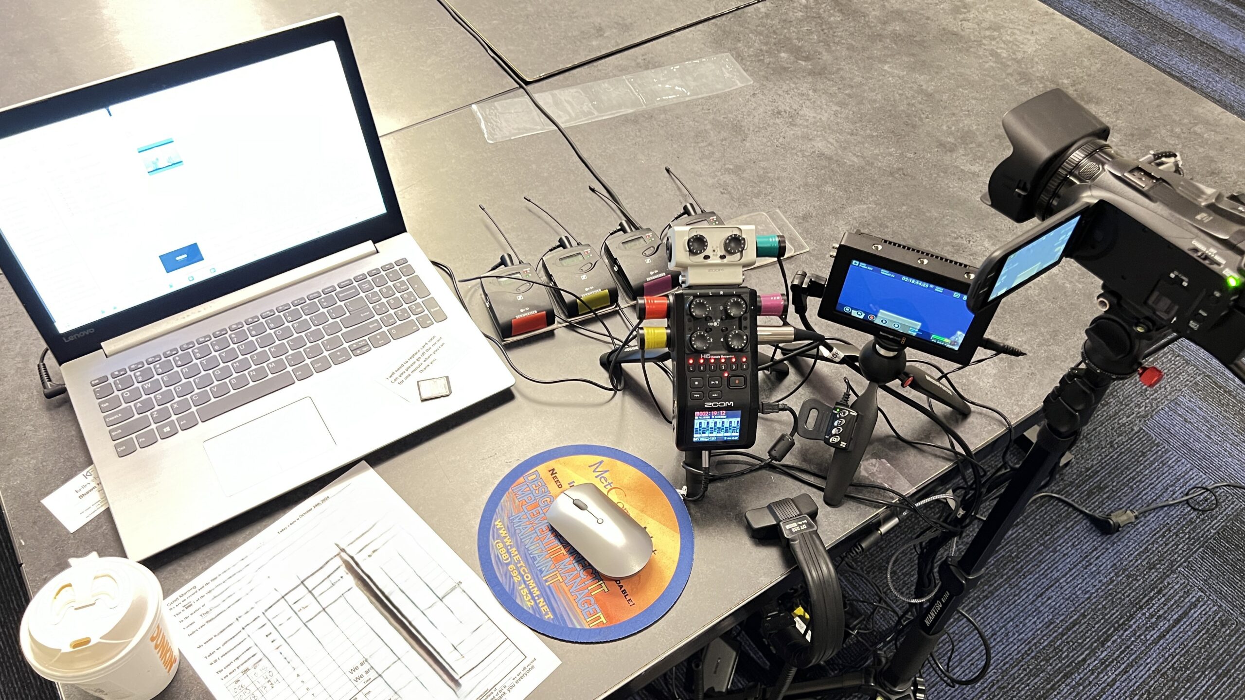 Deposition recording gear in use on conference room table