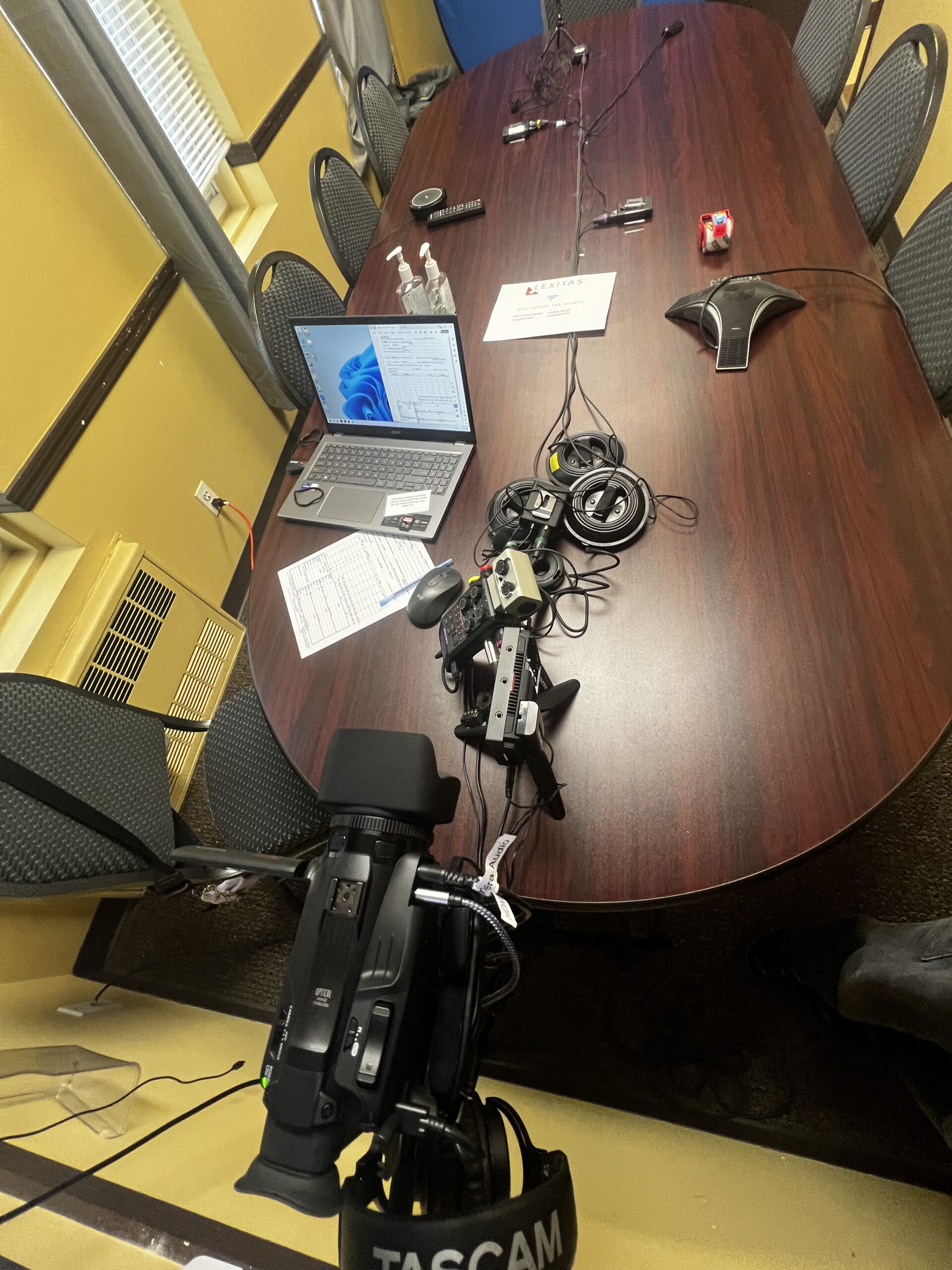 Deposition recording gear in use on conference room table