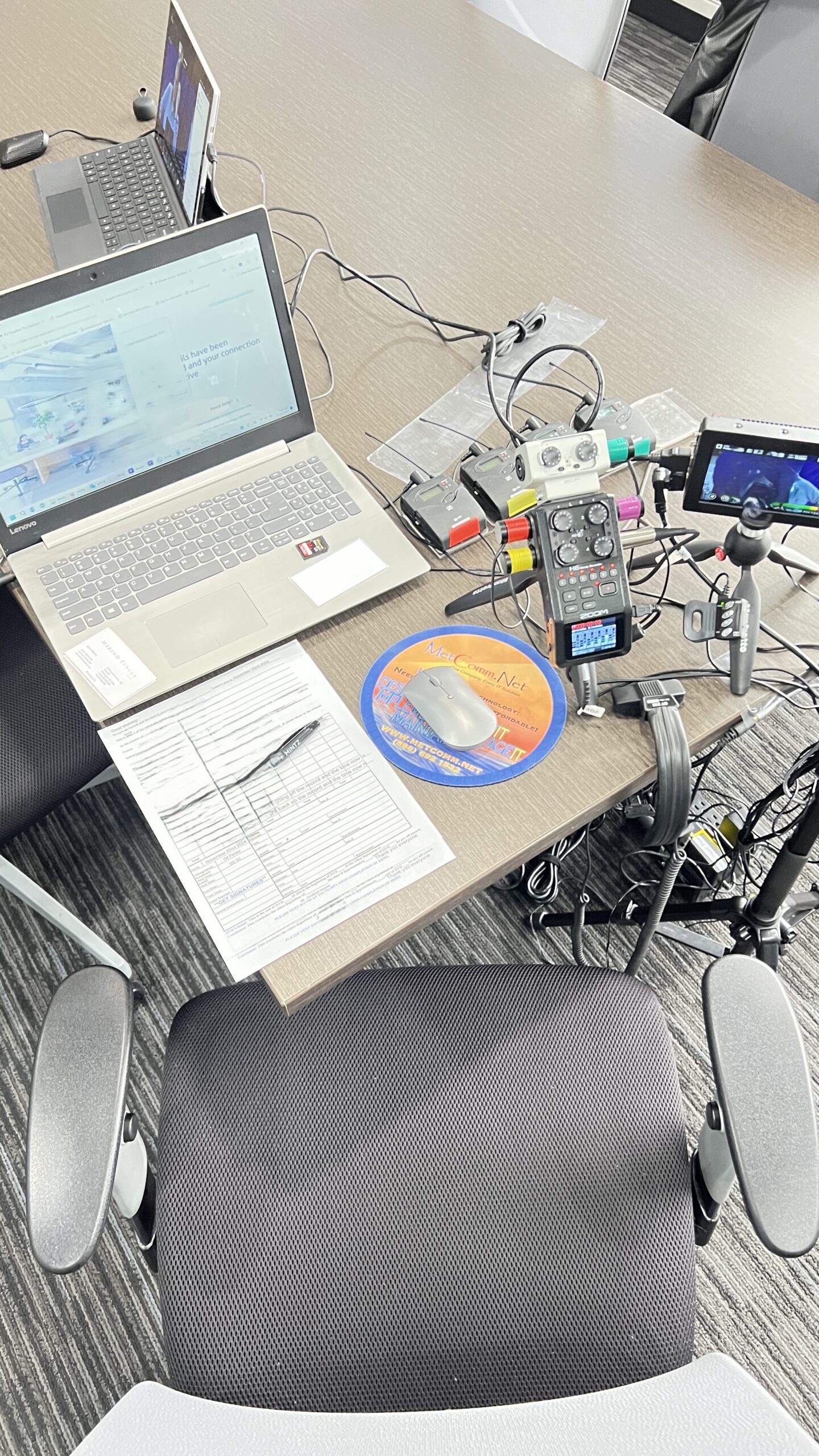 Deposition recording gear in use on conference room table