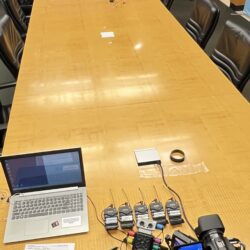 Deposition recording gear in use on conference room table