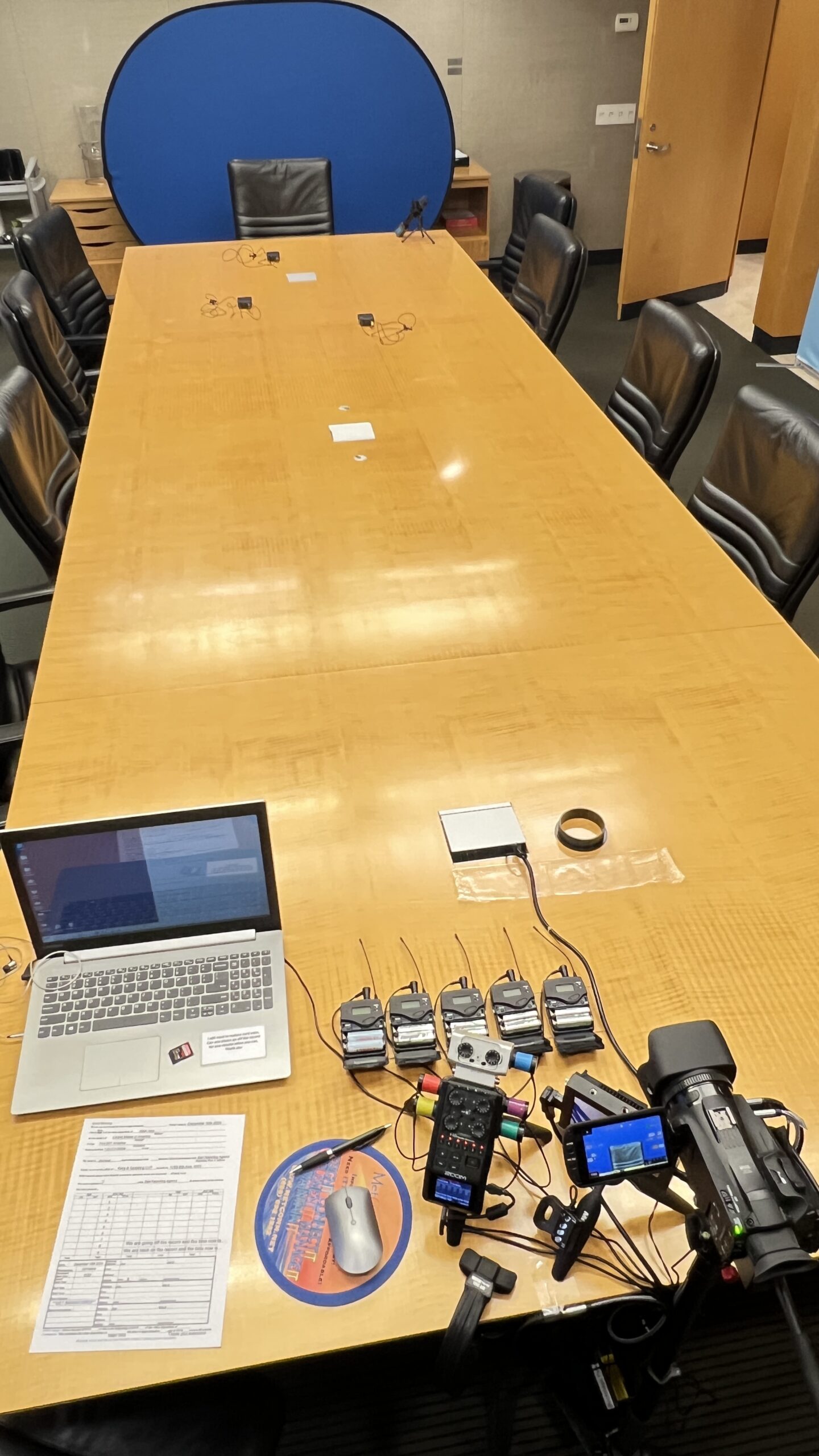 Deposition recording gear in use on conference room table