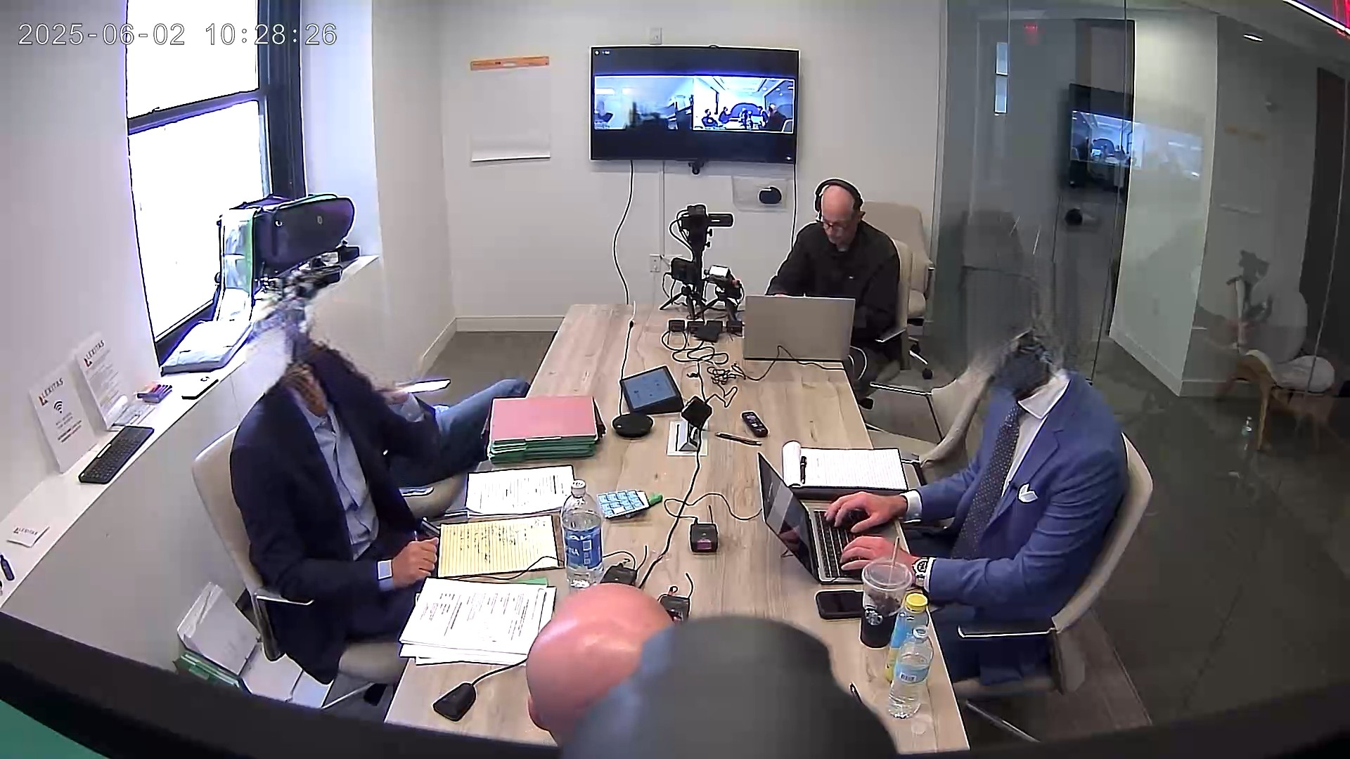 Deposition recording gear in use on conference room table