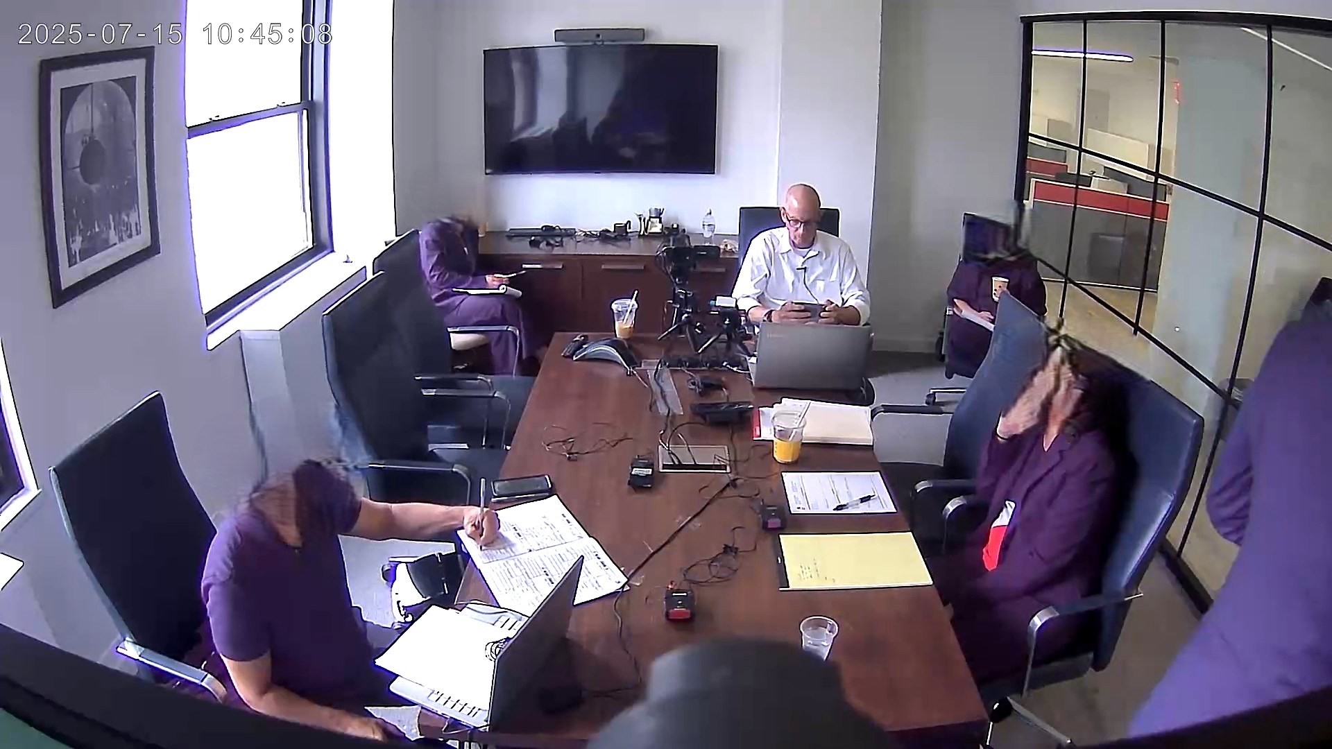 Deposition recording gear in use on conference room table