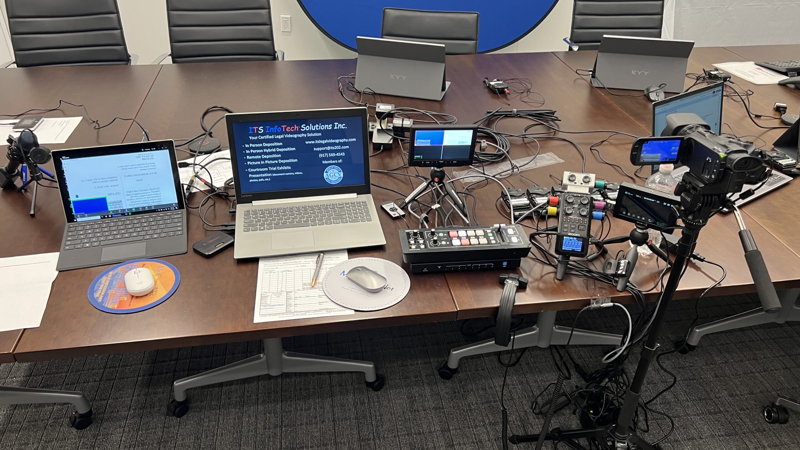 Deposition recording gear in use on conference room table