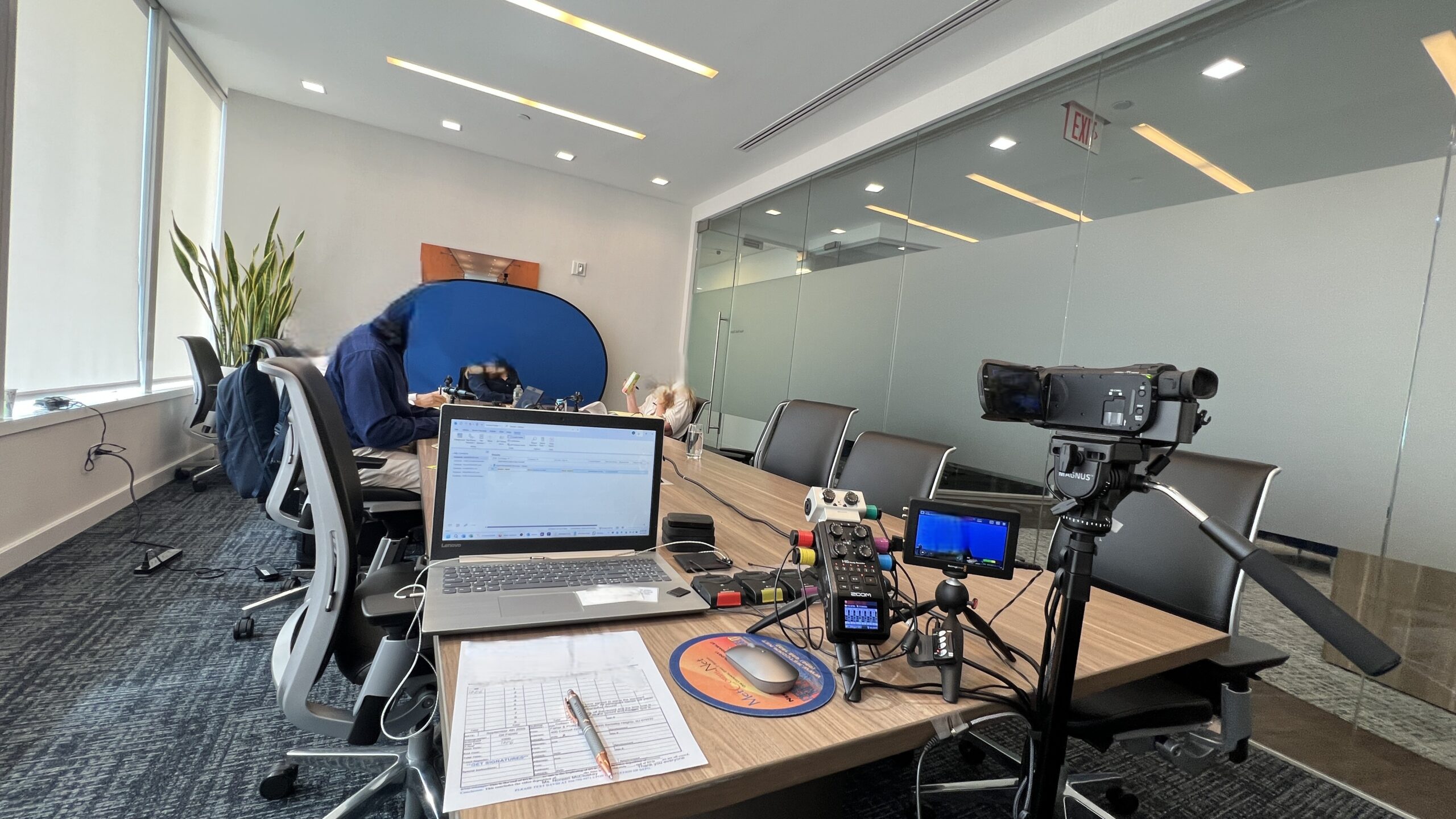Deposition recording gear in use on conference room table