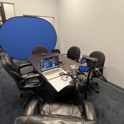 Deposition recording gear in use on conference room table