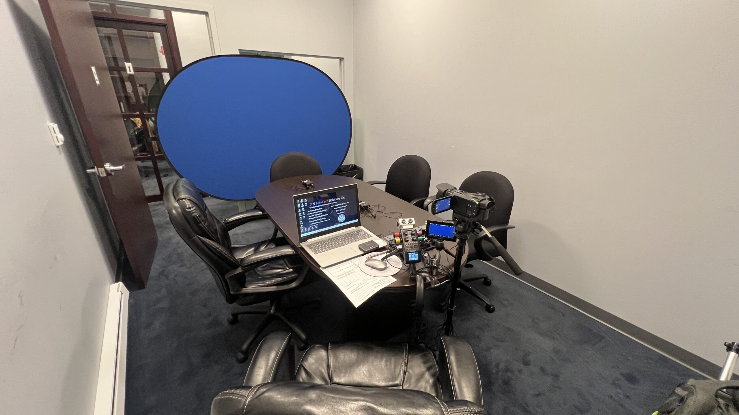Deposition recording gear in use on conference room table