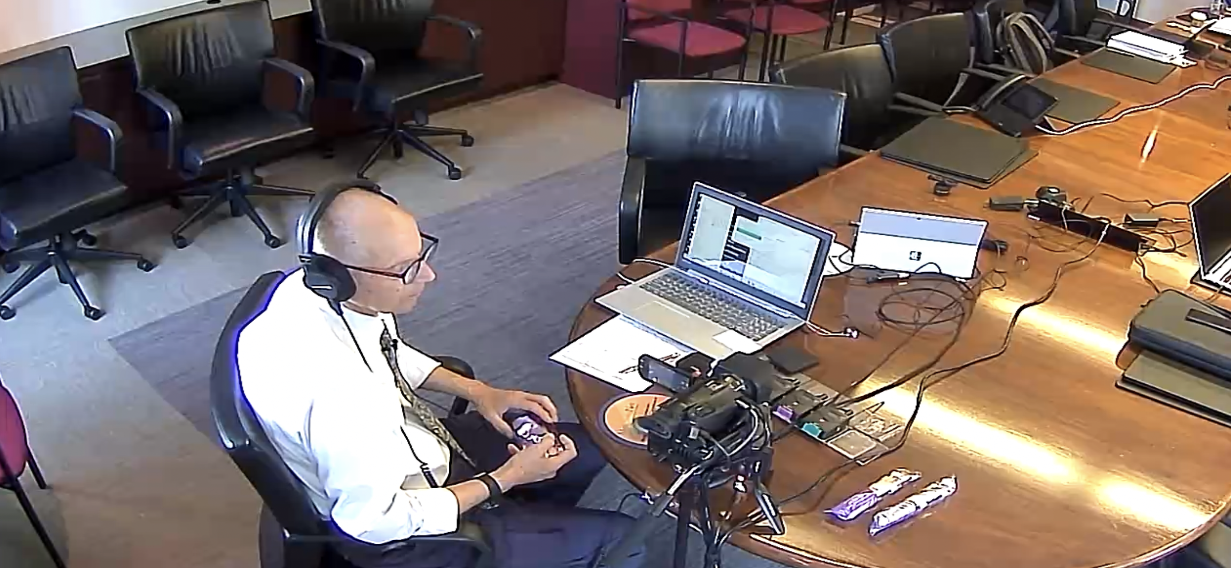 Deposition recording gear in use on conference room table