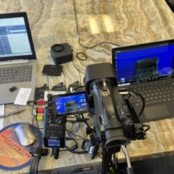 Deposition recording gear in use on conference room table