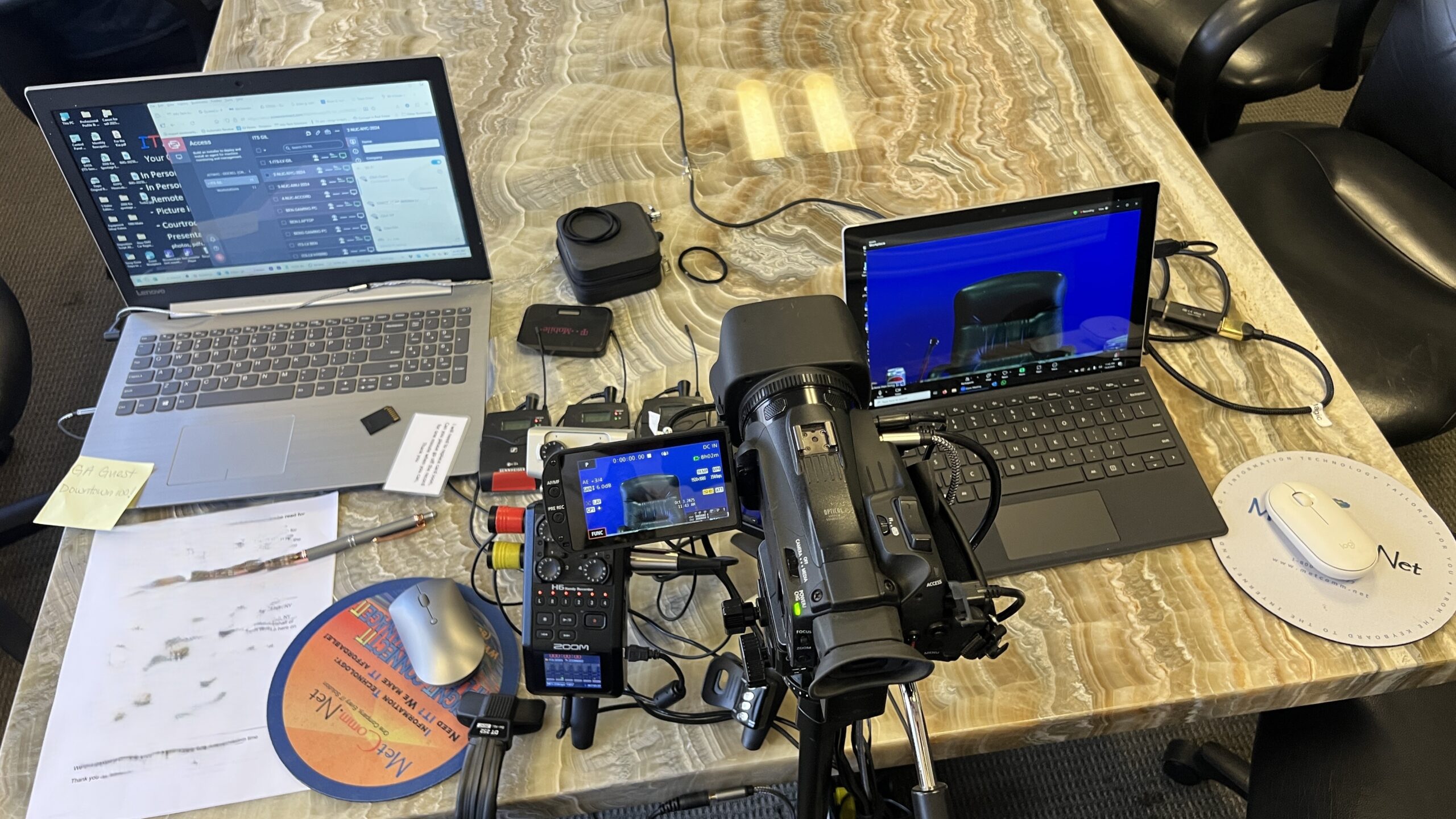 Deposition recording gear in use on conference room table