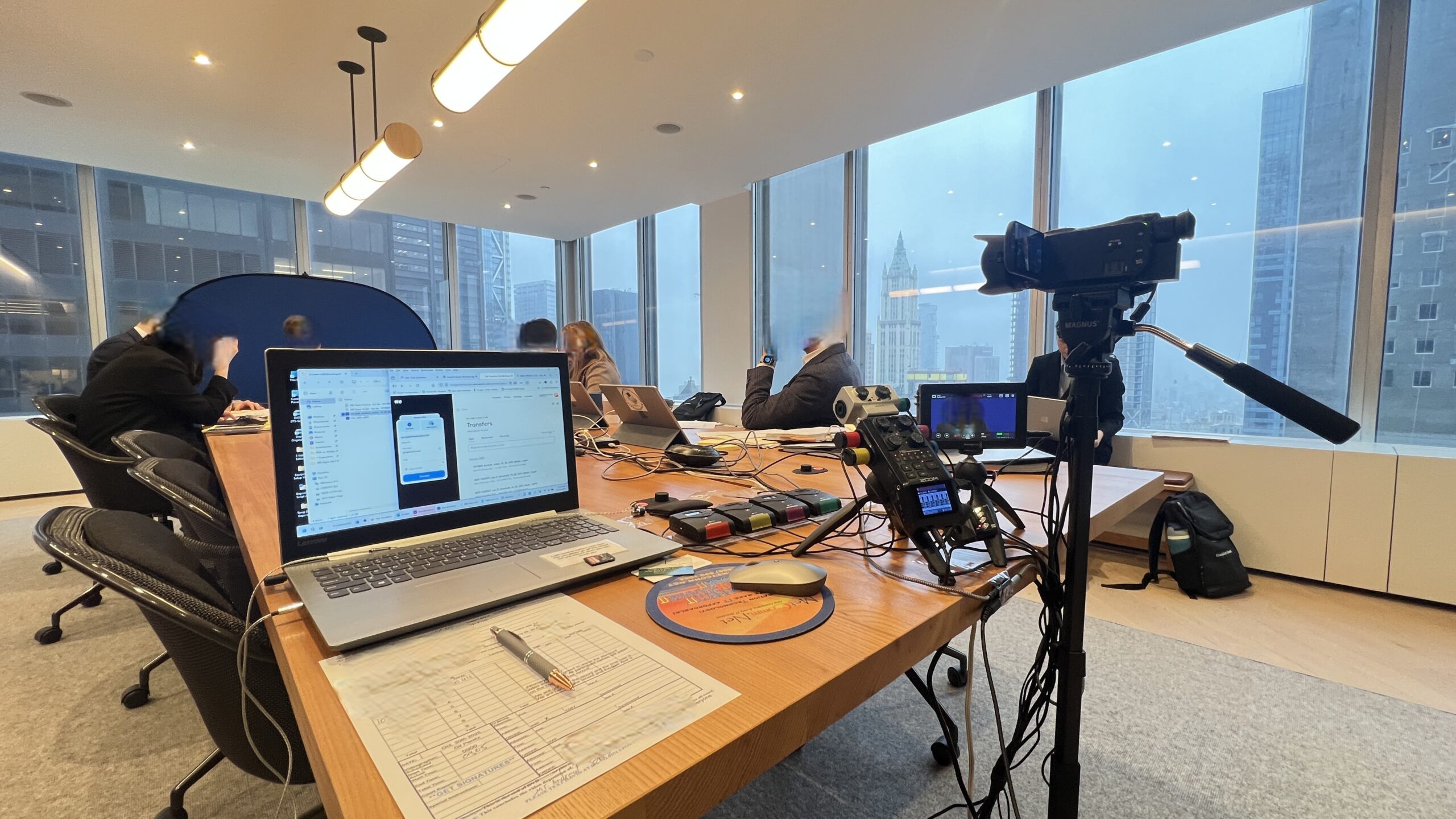 Deposition recording gear in use on conference room table