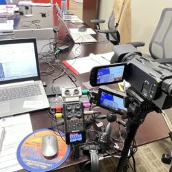 Deposition recording gear in use on conference room table