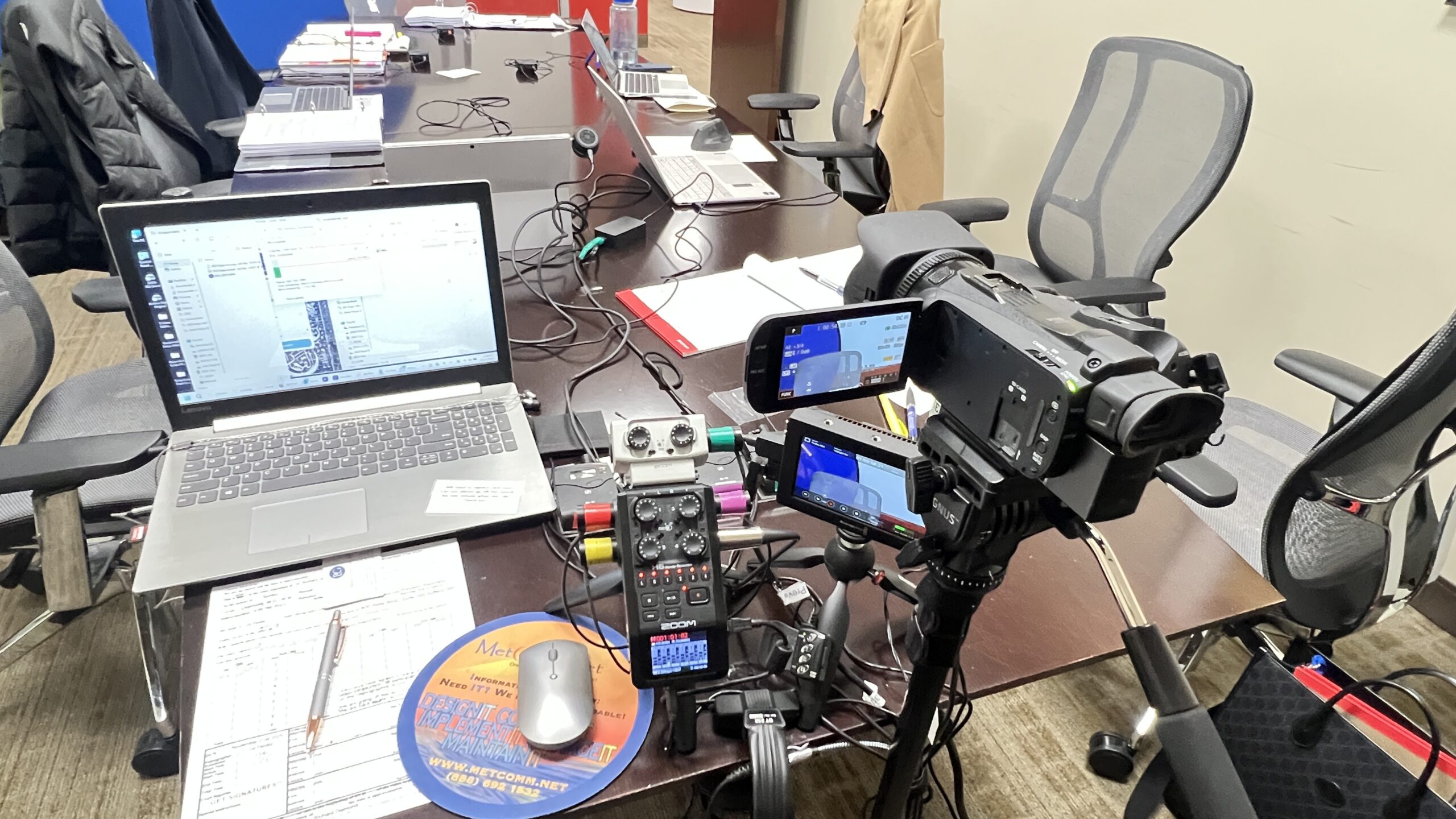 Deposition recording gear in use on conference room table