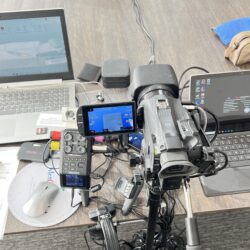 Deposition recording gear in use on conference room table
