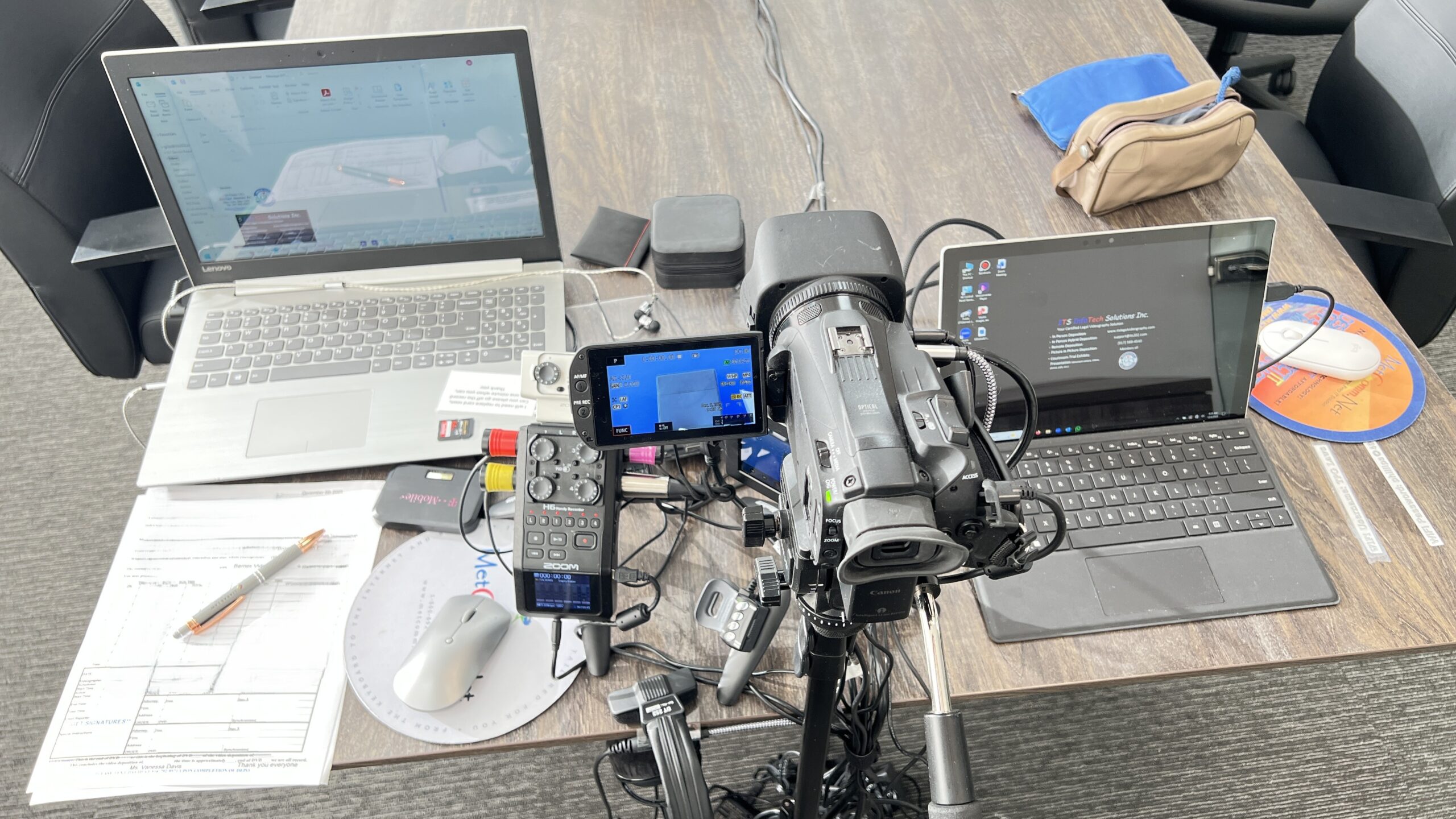 Deposition recording gear in use on conference room table