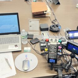 Deposition recording gear in use on conference room table