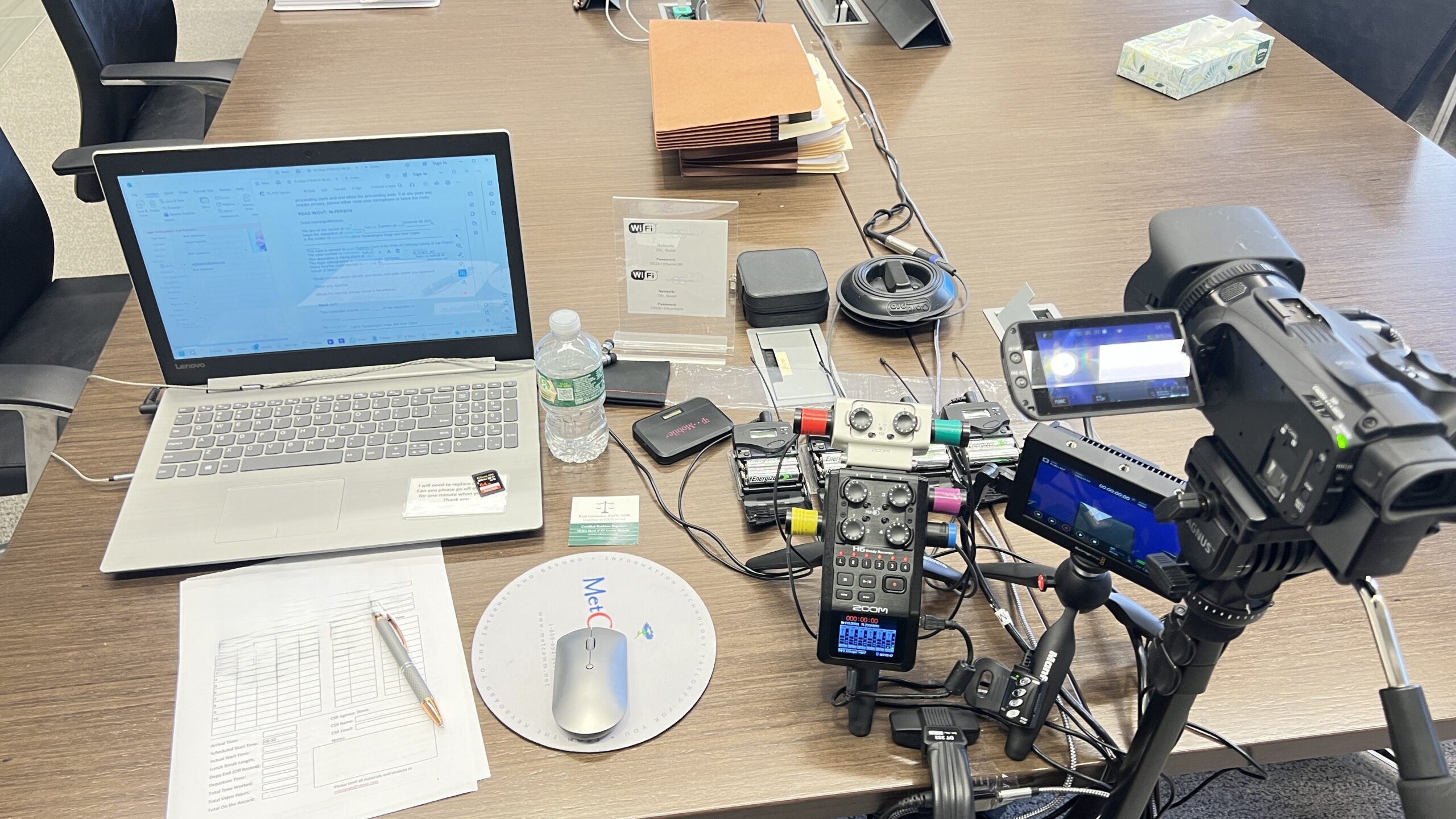 Deposition recording gear in use on conference room table