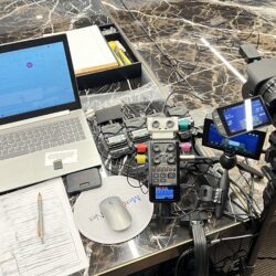 Deposition recording gear in use on conference room table