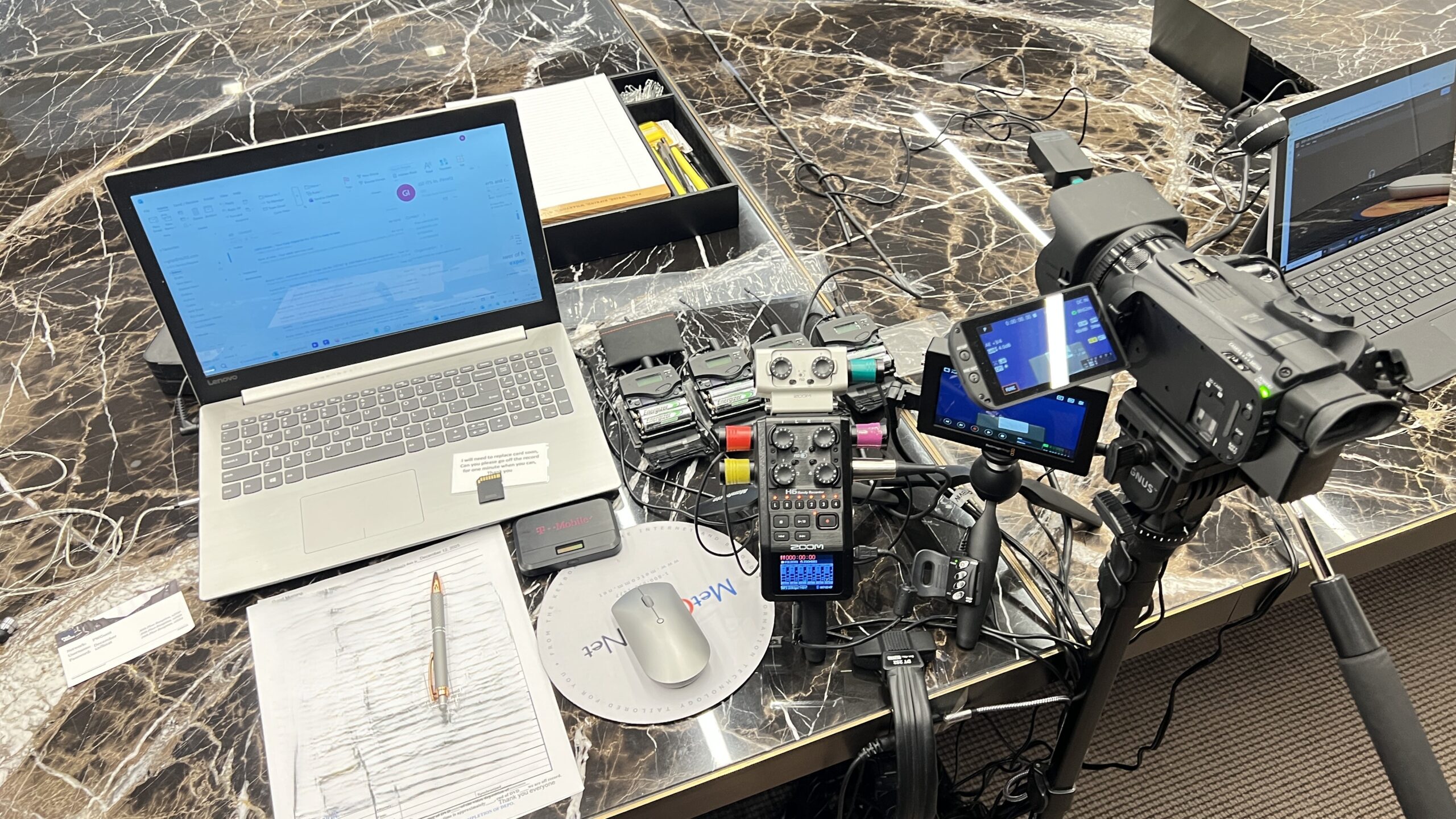 Deposition recording gear in use on conference room table