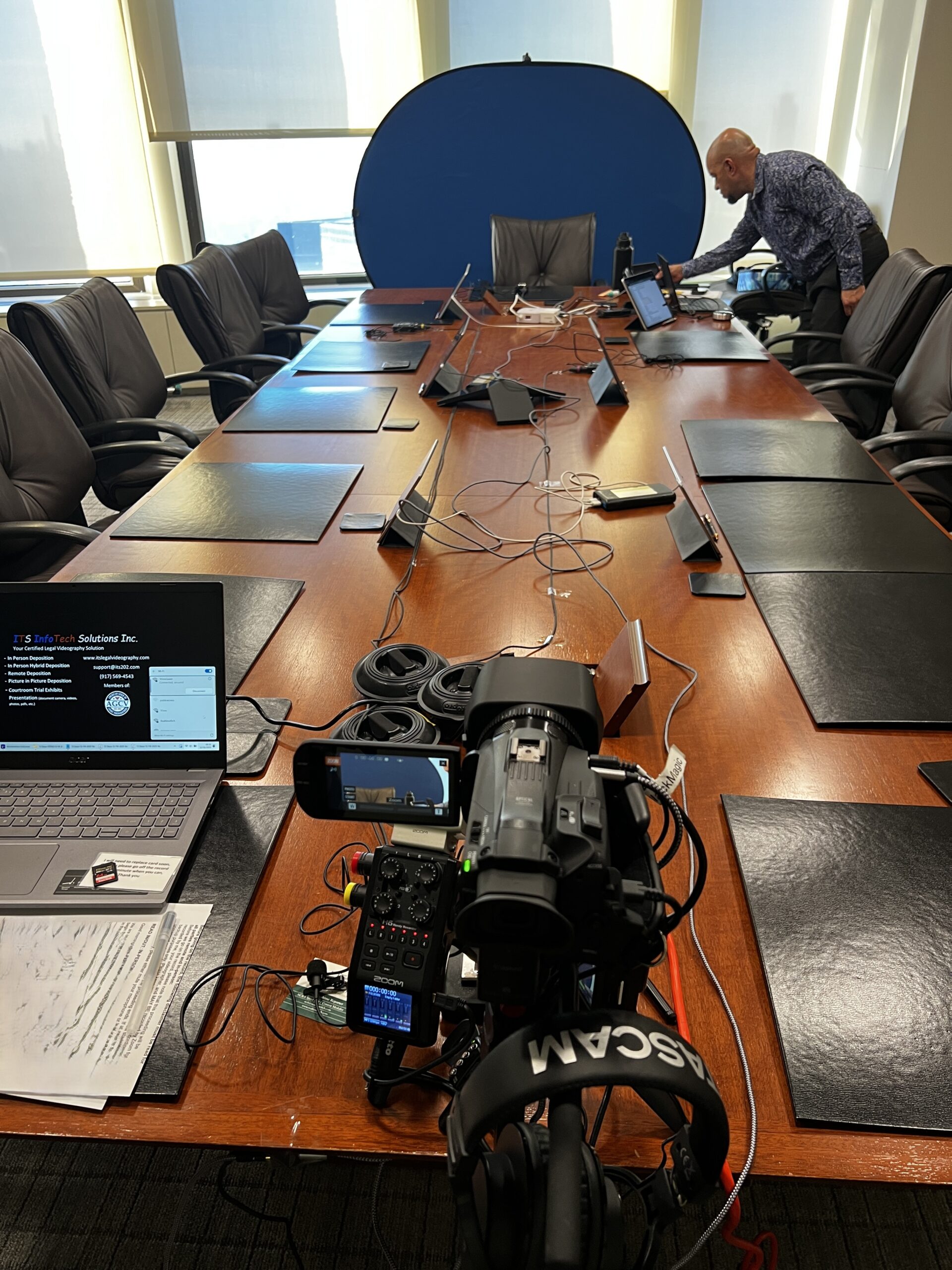 Deposition recording gear in use on conference room table