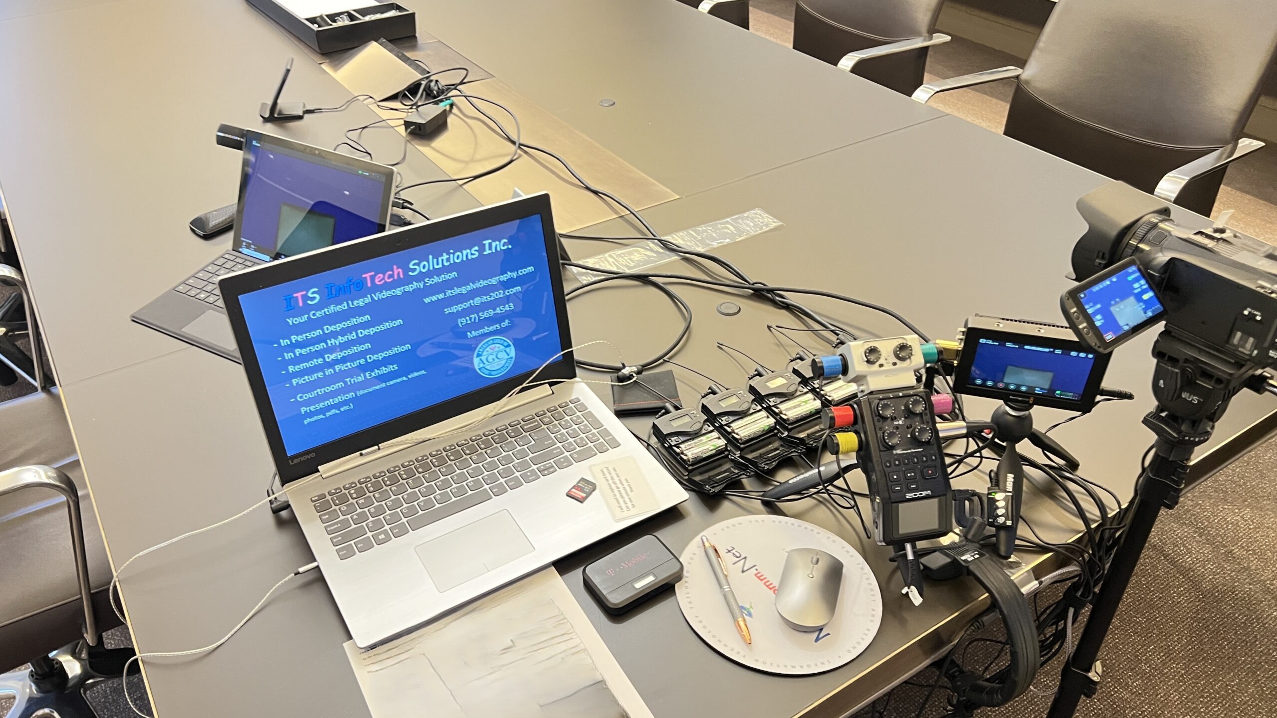 Deposition recording gear in use on conference room table