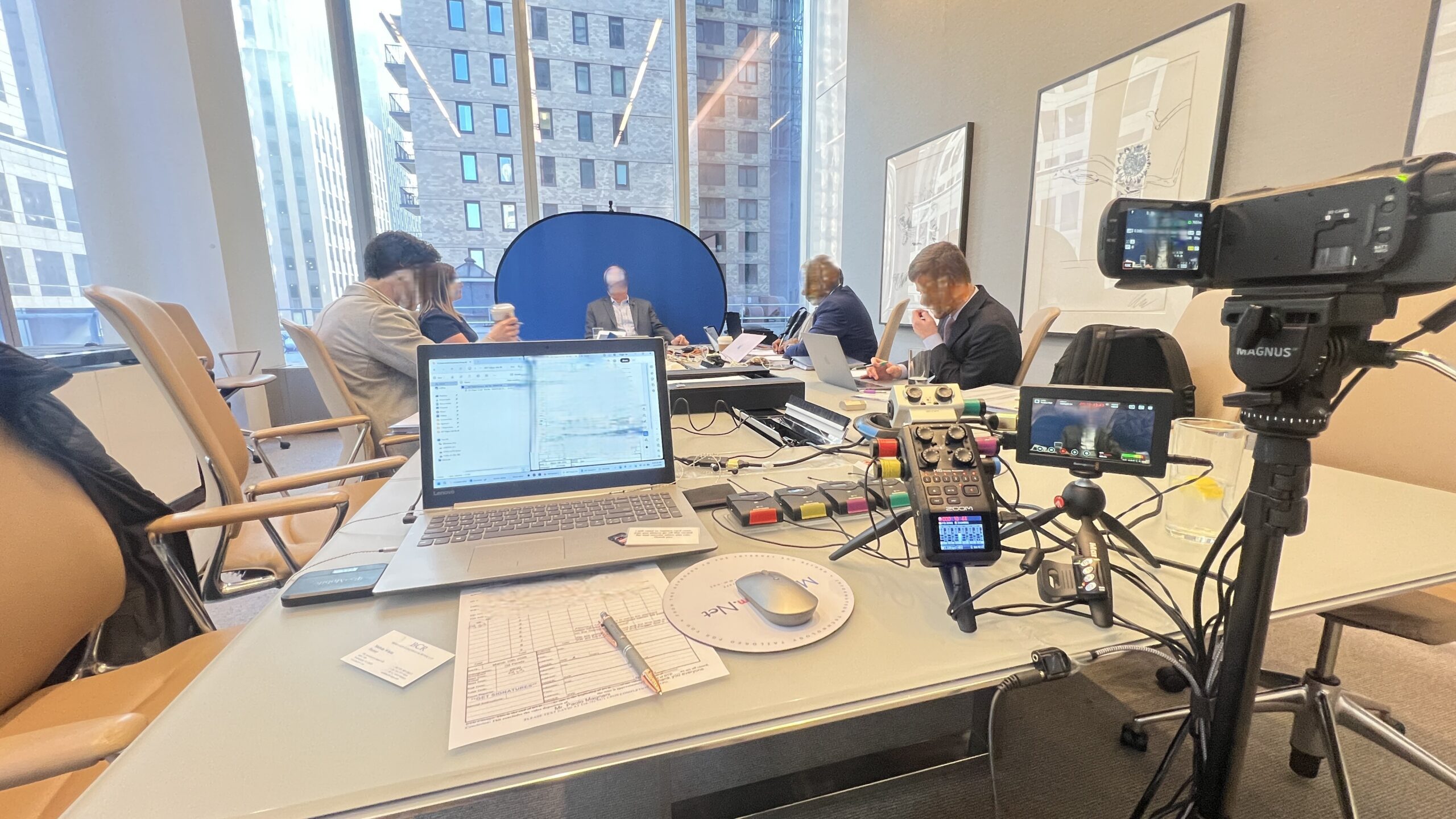 Deposition recording gear in use on conference room table