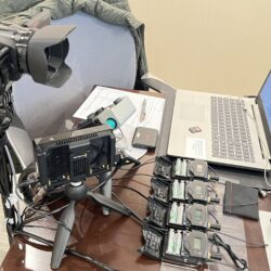 Deposition recording gear in use on conference room table