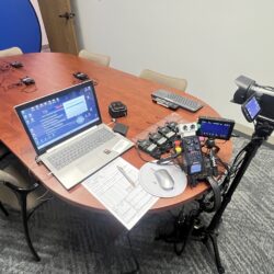 Deposition recording gear in use on conference room table