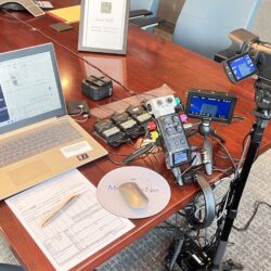 Deposition recording gear in use on conference room table