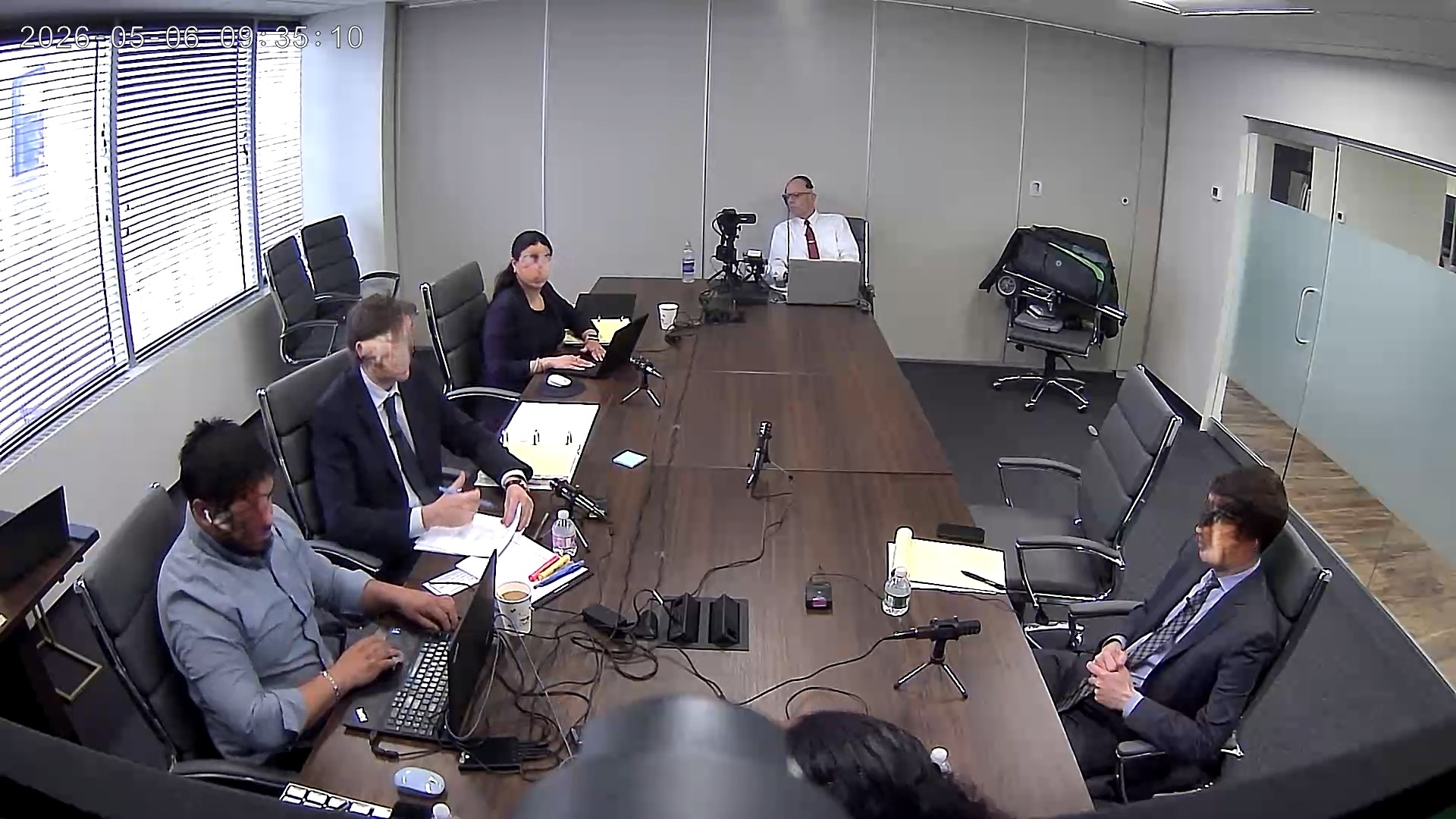 Deposition recording gear in use on conference room table