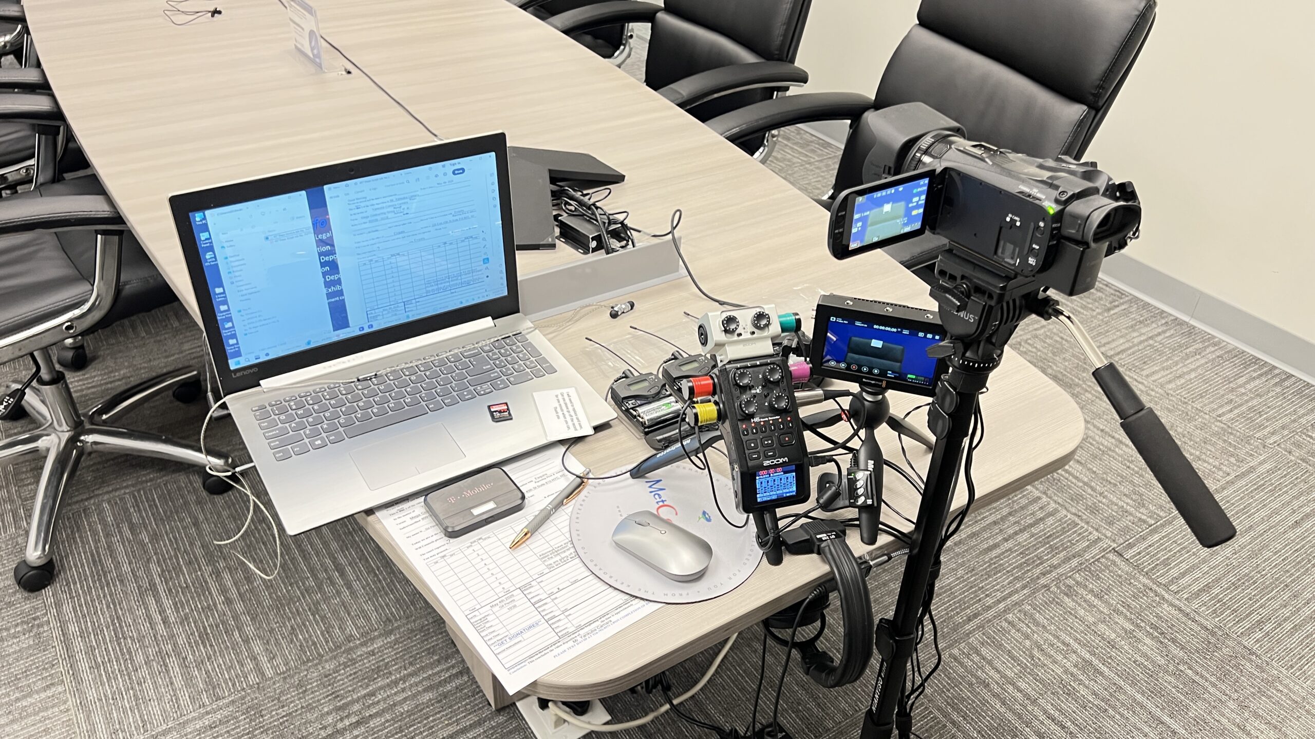 Deposition recording gear in use on conference room table