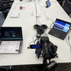 Deposition recording gear in use on conference room table