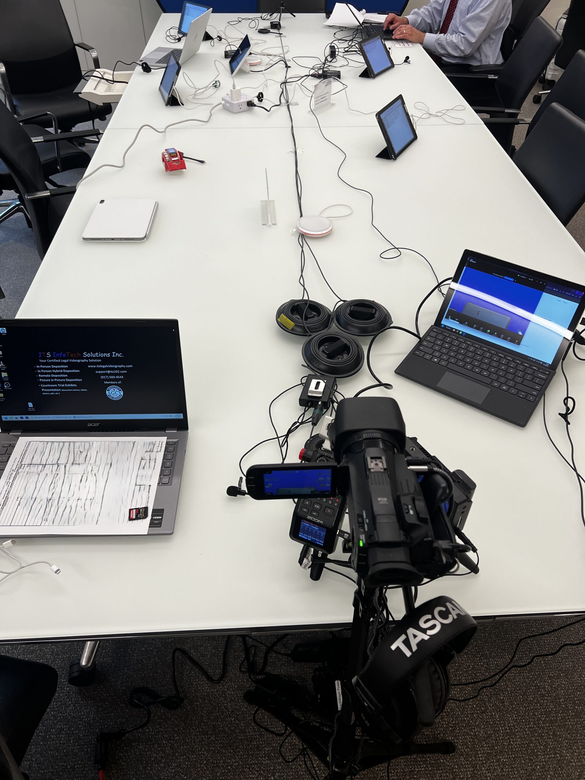 Deposition recording gear in use on conference room table