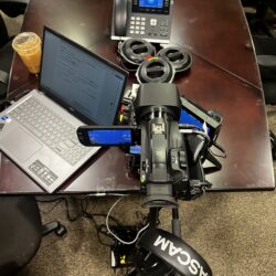 Deposition recording gear in use on conference room table