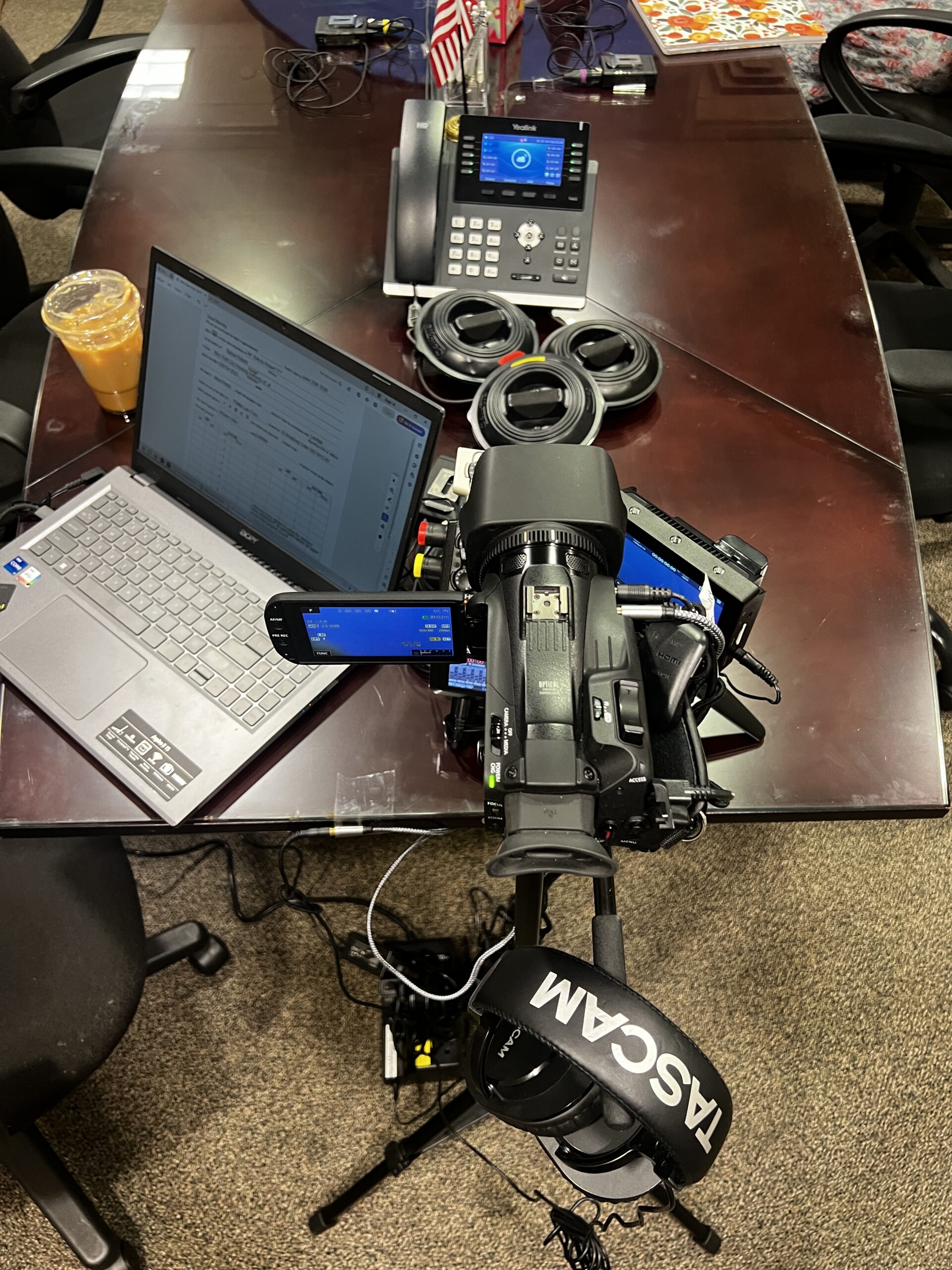 Deposition recording gear in use on conference room table