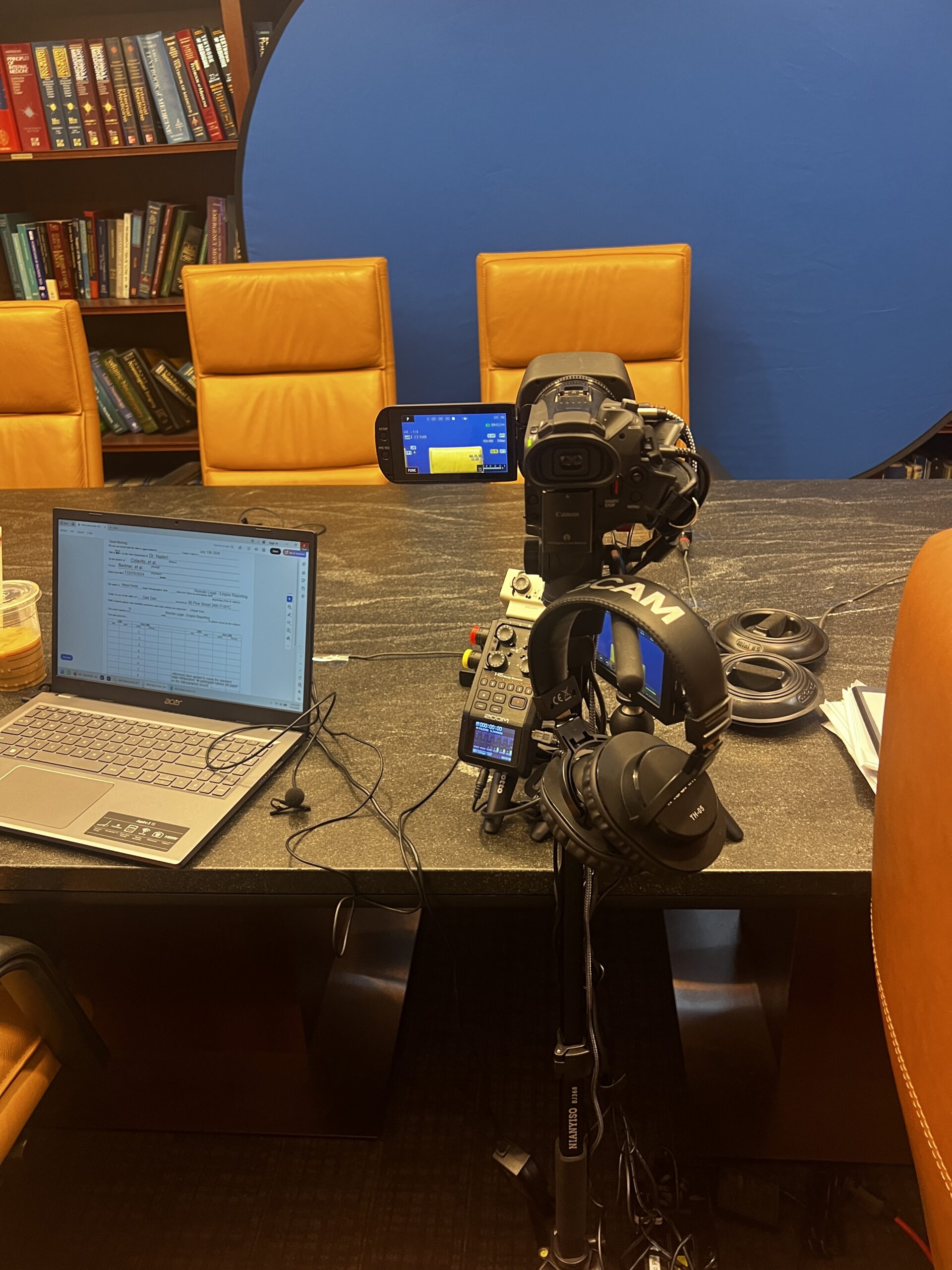 Deposition recording gear in use on conference room table