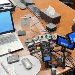 Deposition recording gear in use on conference room table
