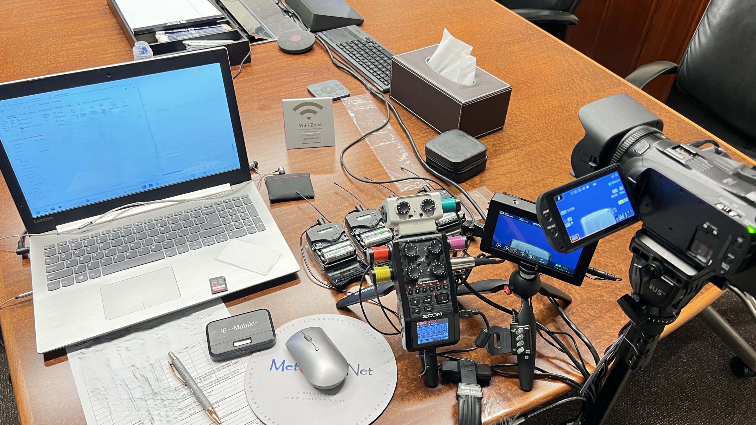 Deposition recording gear in use on conference room table