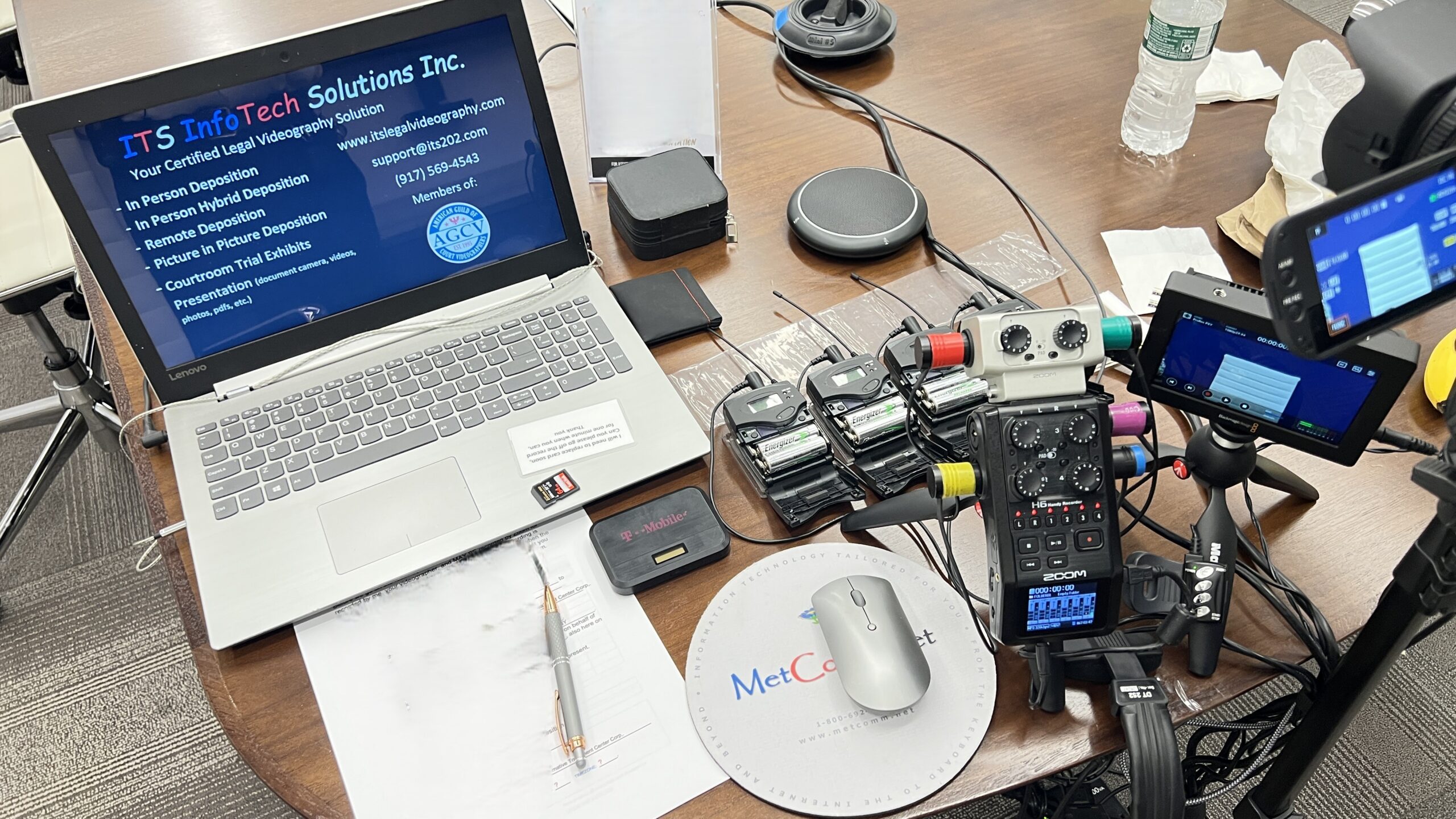 Deposition recording gear in use on conference room table