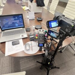 Deposition recording gear in use on conference room table