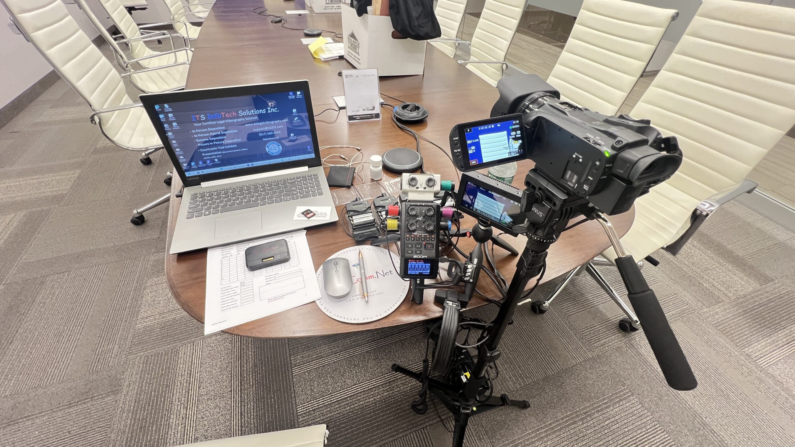 Deposition recording gear in use on conference room table