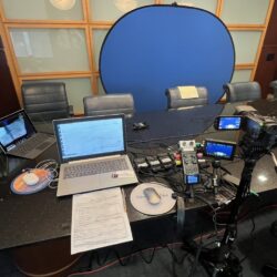 Deposition recording gear in use on conference room table