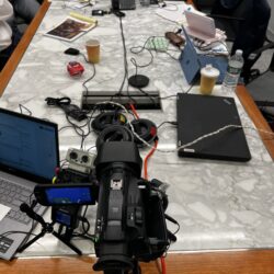 Deposition recording gear in use on conference room table