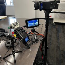 Deposition recording gear in use on conference room table