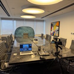 Deposition recording gear in use on conference room table