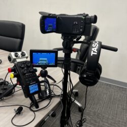 Deposition recording gear in use on conference room table